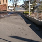 Grease Enclosure Next To Storm Drain