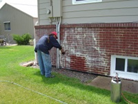 Pressure Washing The White Stains On A Brick House